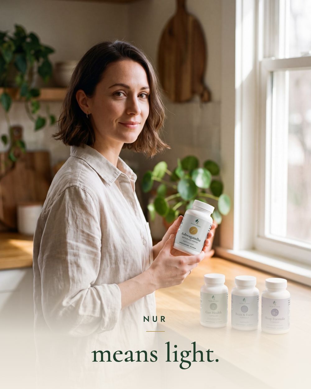 A woman holding a Nuraveda bottle beside a sunlit kitchen window